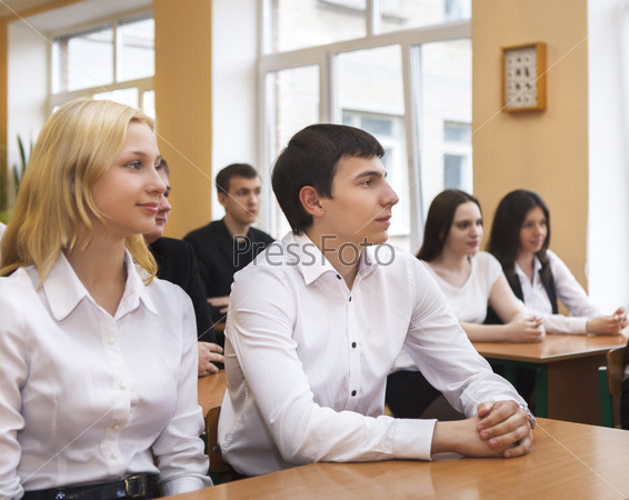 Students in class room listening to the teacher