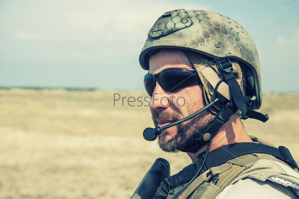 Bearded SEAL team member in the desert
