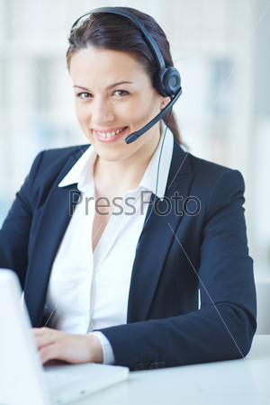Young customer support representative networking in office