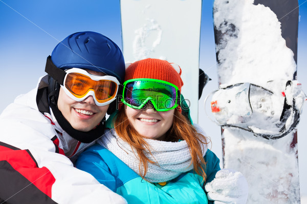 Man and woman in ski mask smiling