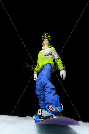 Snowboard girl ready to slide at night