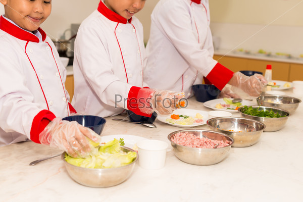 Cropped image of children having cooking class