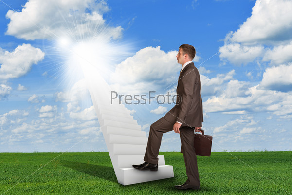 Businessman climbing up stairs leading to sky. Business concept, stock photo