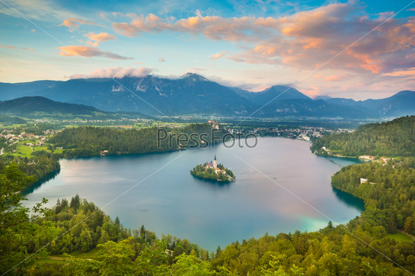 Sunset view of Julian Alps and Lake Bled with St. Marys Church of the Assumption on the small island. Bled, Slovenia, Europe. , stock photo