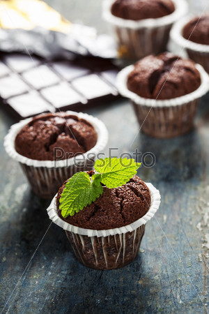 Chocolate muffins on wooden board - food and drink