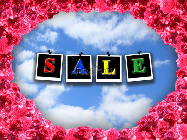 inscription sale on the blue sky background with red roses