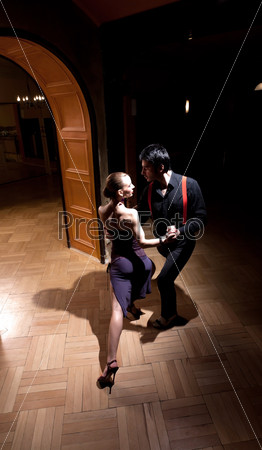 A man and a woman dancing argentinian tango. Please see more images from the same shoot.