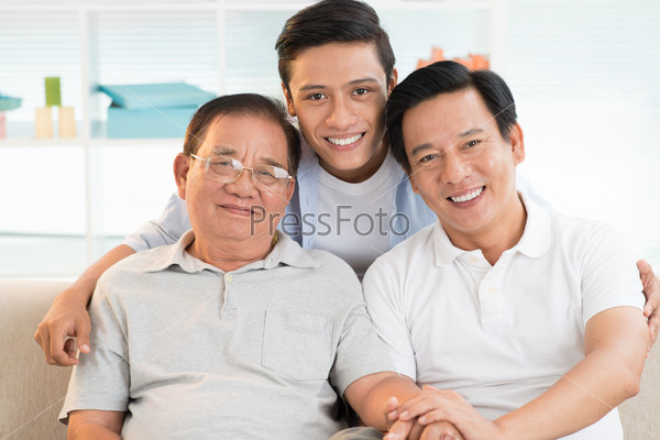 Portrait of Asian grandfather, father and son bonding together