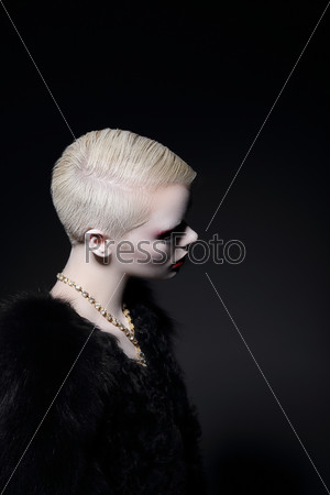 Charisma. Profile of Blonde Fashion Model with Bob Hairdo