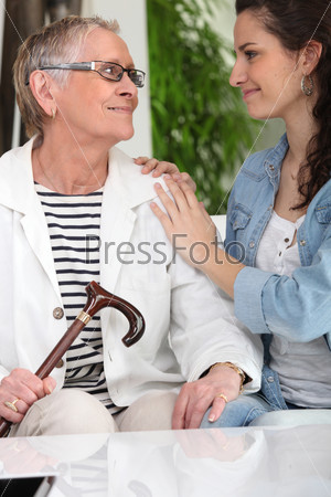 Old lady with young carer