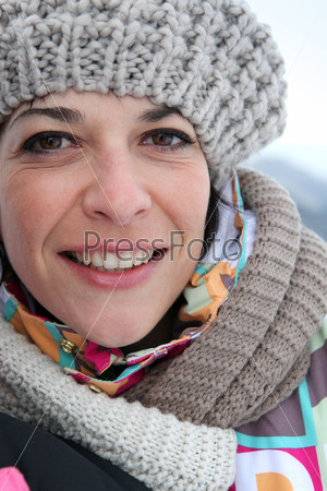 Woman dressed in warm winter clothing, stock photo