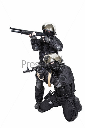 Two spec ops soldiers in black uniform in action