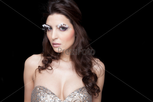 Sensual and elegant lady with long lashes made of white feathers.