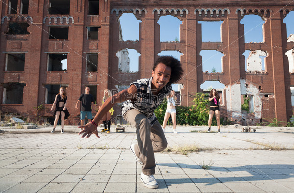 Energetic street dancer lunging at the camera