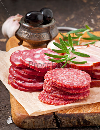 Assorted deli meats, rosemary and pepper