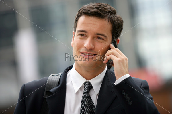 Busy businessman making call in between appointments