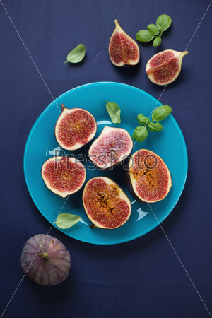 Still life food: sliced figs, above view, vertical shot