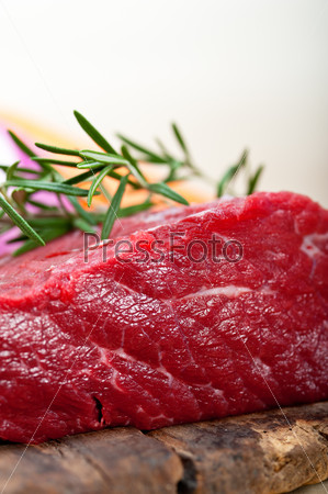fresh raw beef cut ready to cook with vegetables and herbs