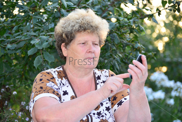 Middleaged woman talks on the mobile phone