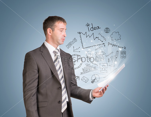 Businessman in suit hold paper sheets with business sketches