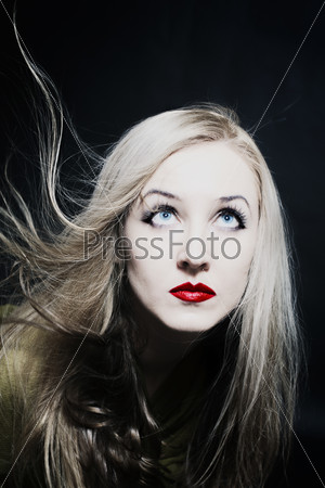 Healthy beautiful long hair in motion created by wind, fashion l