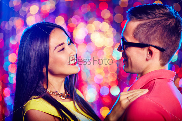 Portrait of a beautiful couple dancing at nightclub