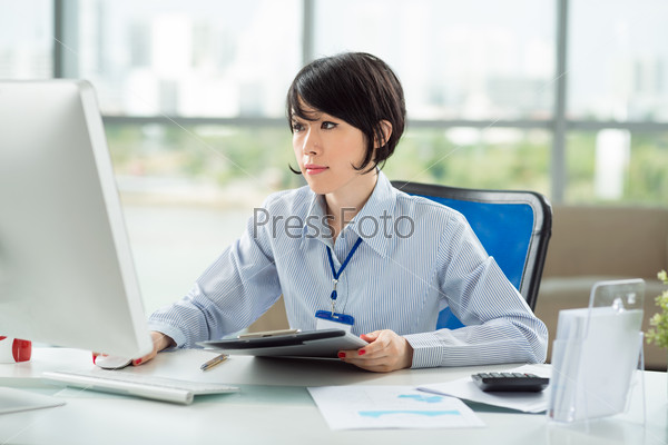 Portrait of young white collar worker in office