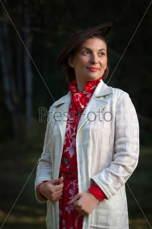 Young beautiful woman posing in vintage clothes