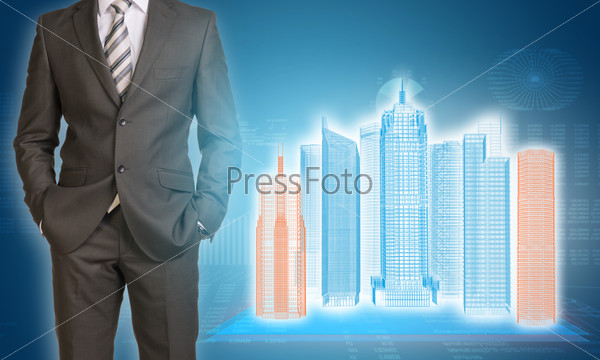 Businessman and wire-frame buildings on transparent planes