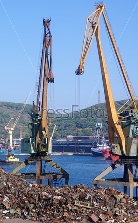 Recycling, loading scrap metal in the ship. Russia. Port of Nakhodka. Primorskiy Kray.