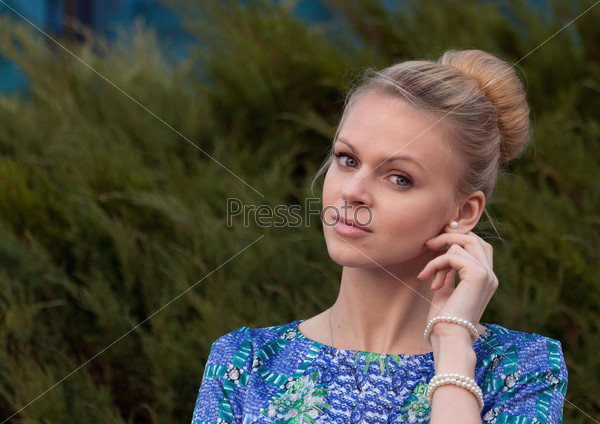 Young girl blonde on simple background