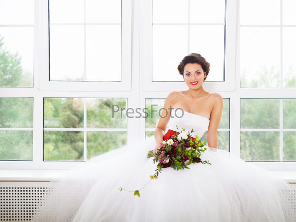 Bride holding unusual wedding bouquet