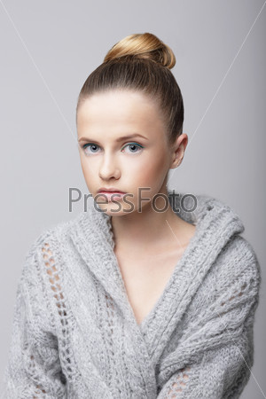 Studio Portrait of Young Female in Gray Woolen Cardigan