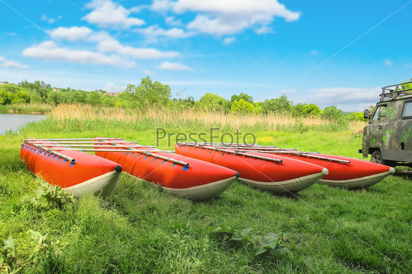 Catamarans for rafting on the river bank