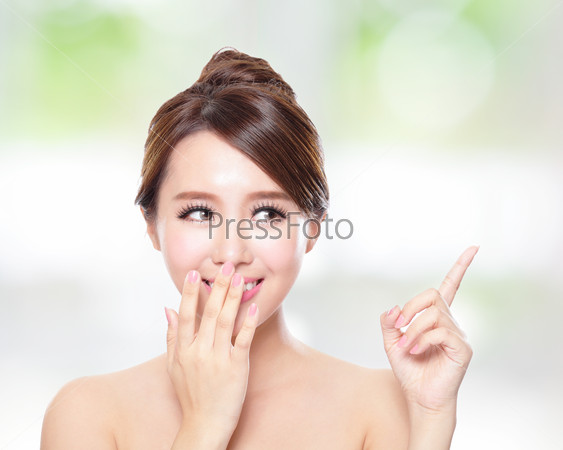 attractive woman with health skin and teeth, she is happy talk to you with nature green background, asian