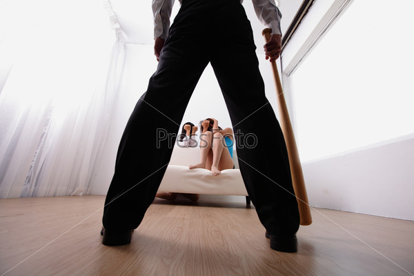 domestic violence - man holding baseball bat look his family, asian