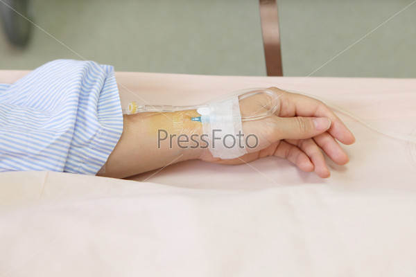 Patient hand with an intravenous drip