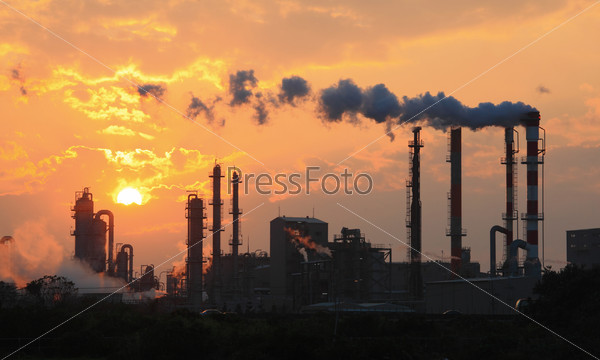 Air pollution smoke from pipes and factory with sunset background