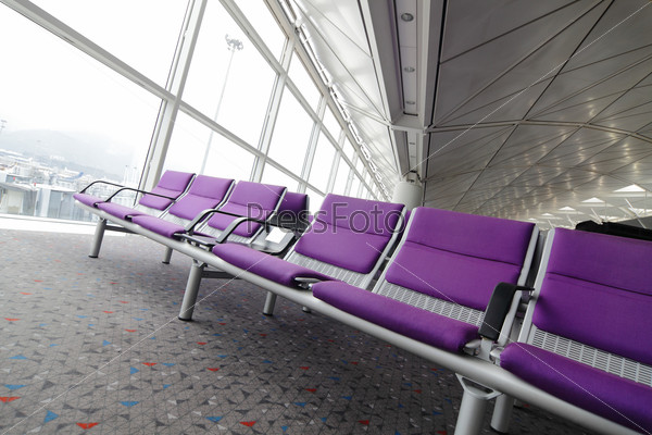 row of purple chair at airport