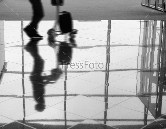 Passenger (Man) rushing through airport terminal