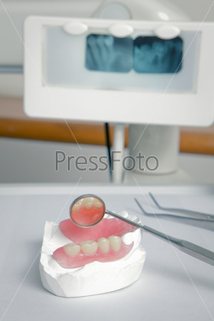 Dentist tools with acrylic denture (False teeth)