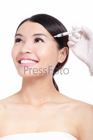 Cosmetic botox injection in woman face. Eye zone. Isolated on\
white background, model is a asian beauty