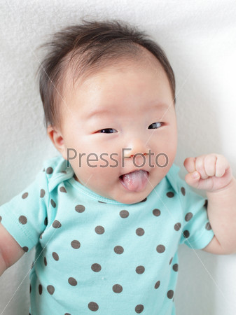Funny baby smile face with cute tongue