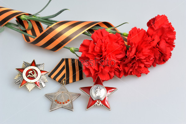 Red flowers tied with Saint George ribbon, orders of Great Patriotic War