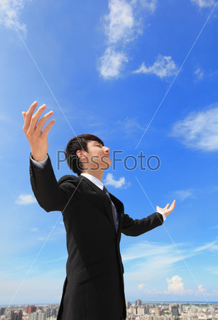 Business man carefree outstretched arms
