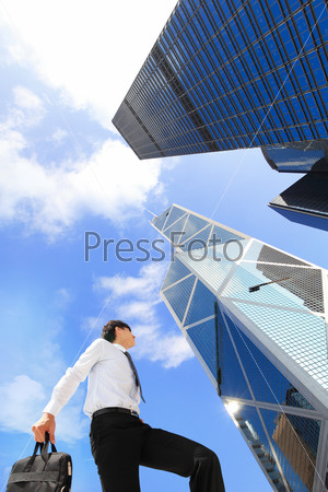 happy successful business man outdoors Next to Office Buildings with cityscape and sky, hong kong, asia, , asian people