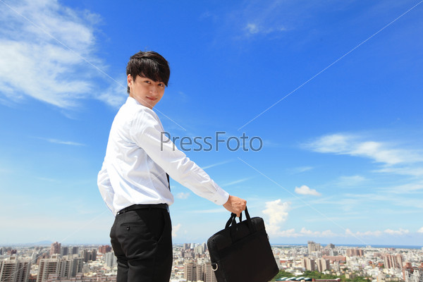 Successful handsome business man with blue sky and city background, mode is a asian male