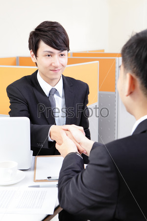 Portrait of successful businessman at the interview at office, asian people