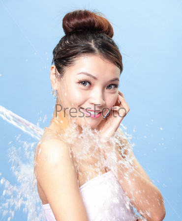 Portrait of beautiful woman with clean skin under the stream of water , asian