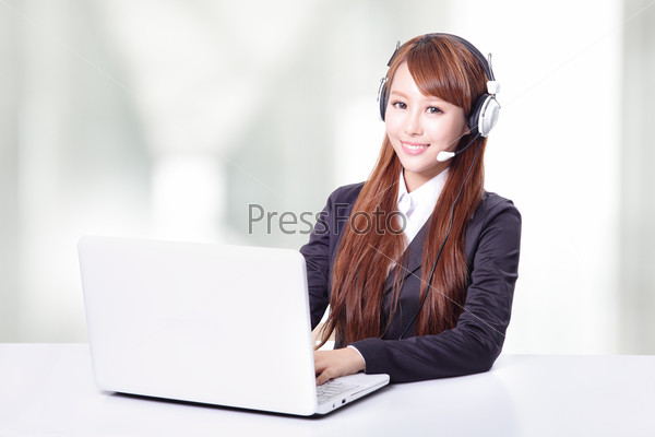 Friendly call center secretary consultant woman with headset telephone and pretty smile in office, asian model